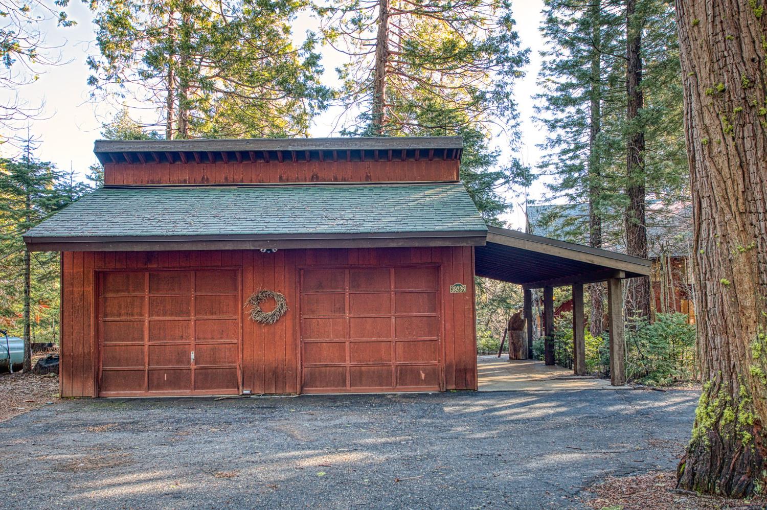 39326 Littlefield Road Shaver Lake, CA 93664 - Photo 38 of 49 a front view of a house with a yard and garage