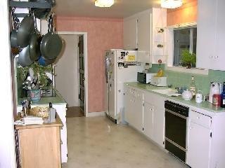 501 Heather Way San Rafael, CA 94903 - Photo 3 of 4 a kitchen with stainless steel appliances granite countertop a sink and cabinets