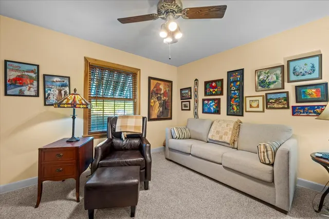 a bedroom with furniture and a window