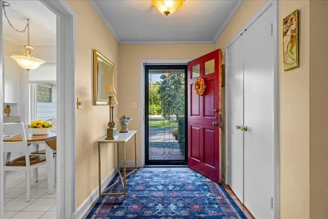 a living room with furniture a window and a fireplace