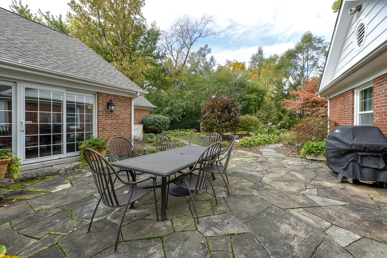 202 Dewey Road Inverness, IL 60067 - Photo 20 of 20 a view of a table and chairs in back yard of a house