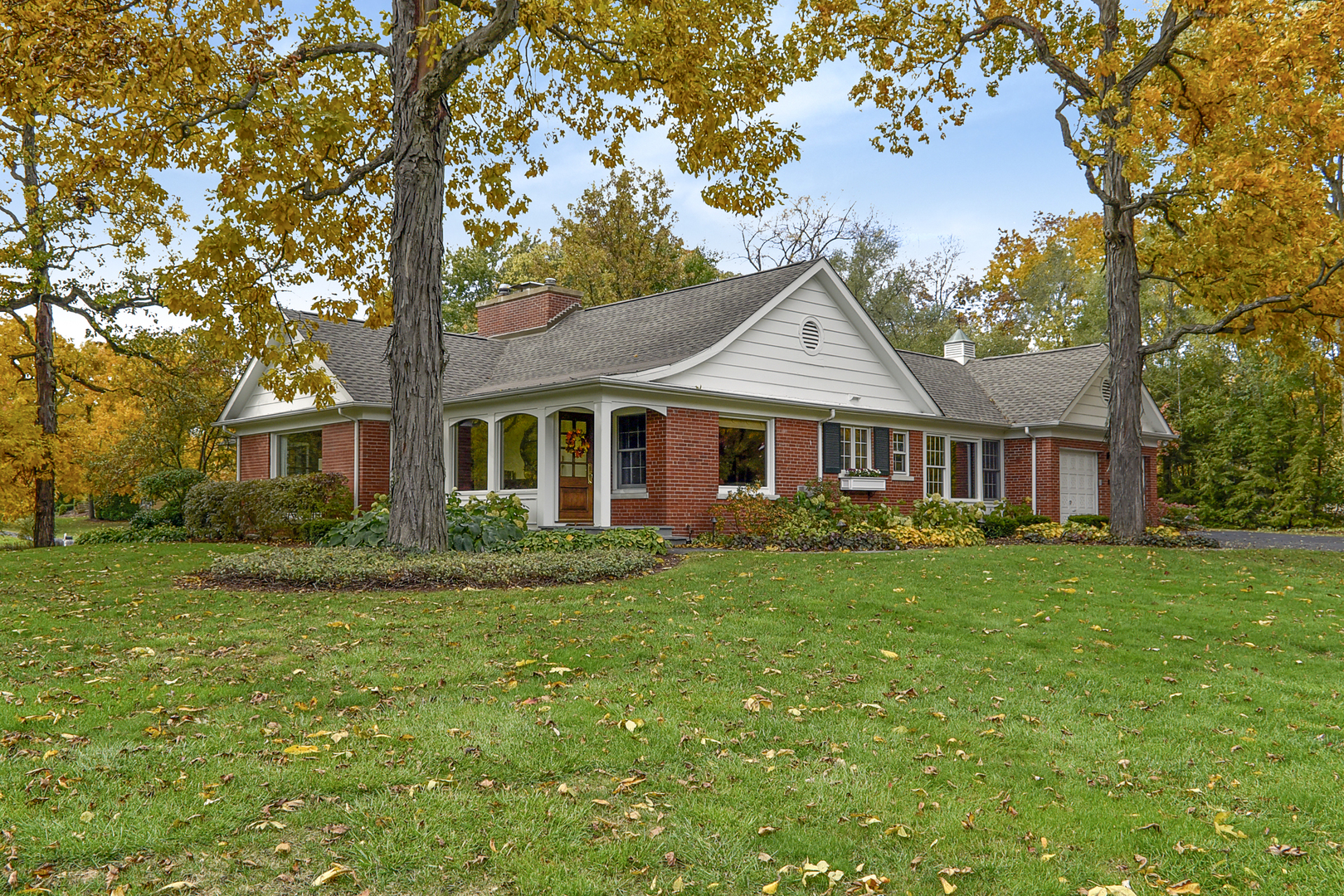 202 Dewey Road Inverness, IL 60067 - Photo 2 of 20 a front view of a house with a garden
