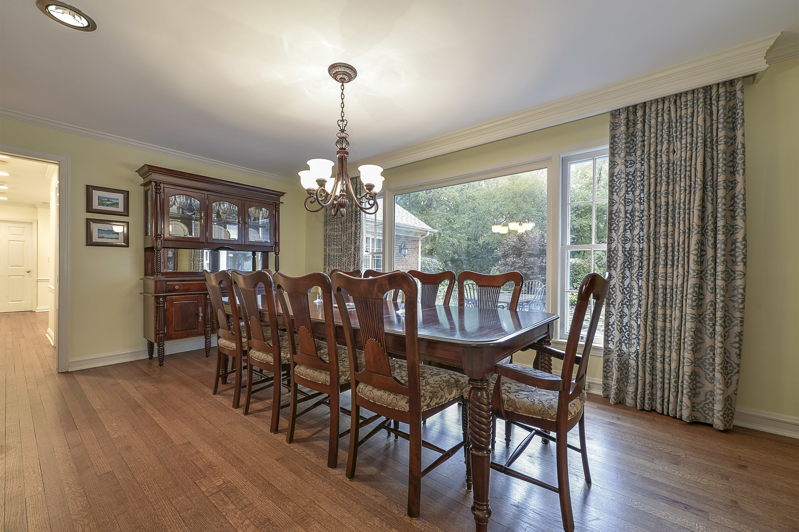 202 Dewey Road Inverness, IL 60067 - Photo 8 of 20 a view of a dining room with furniture window and wooden floor