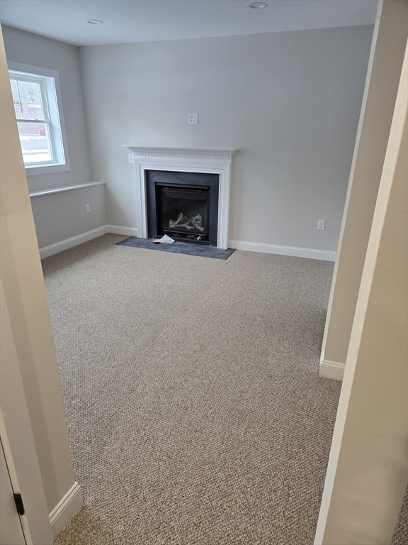 39 Tamarock Terrace Stoneham, MA 02180 - Photo 12 of 13 a view of empty room with a fireplace