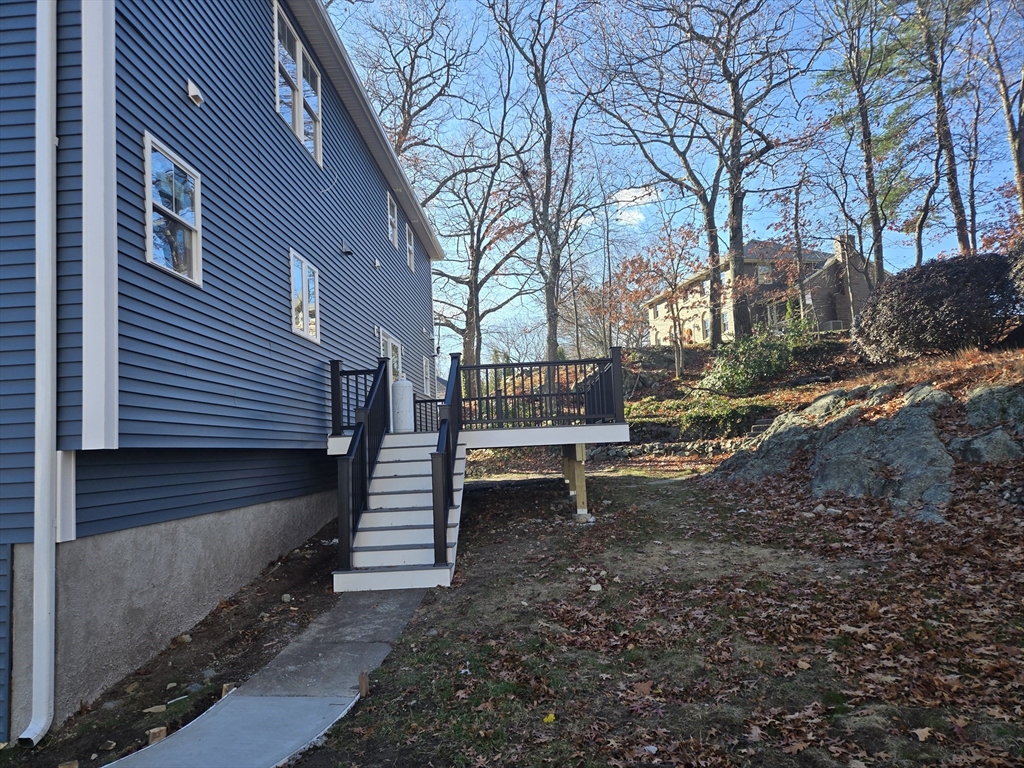 39 Tamarock Terrace Stoneham, MA 02180 - Photo 3 of 13 a view of a bench in a yard