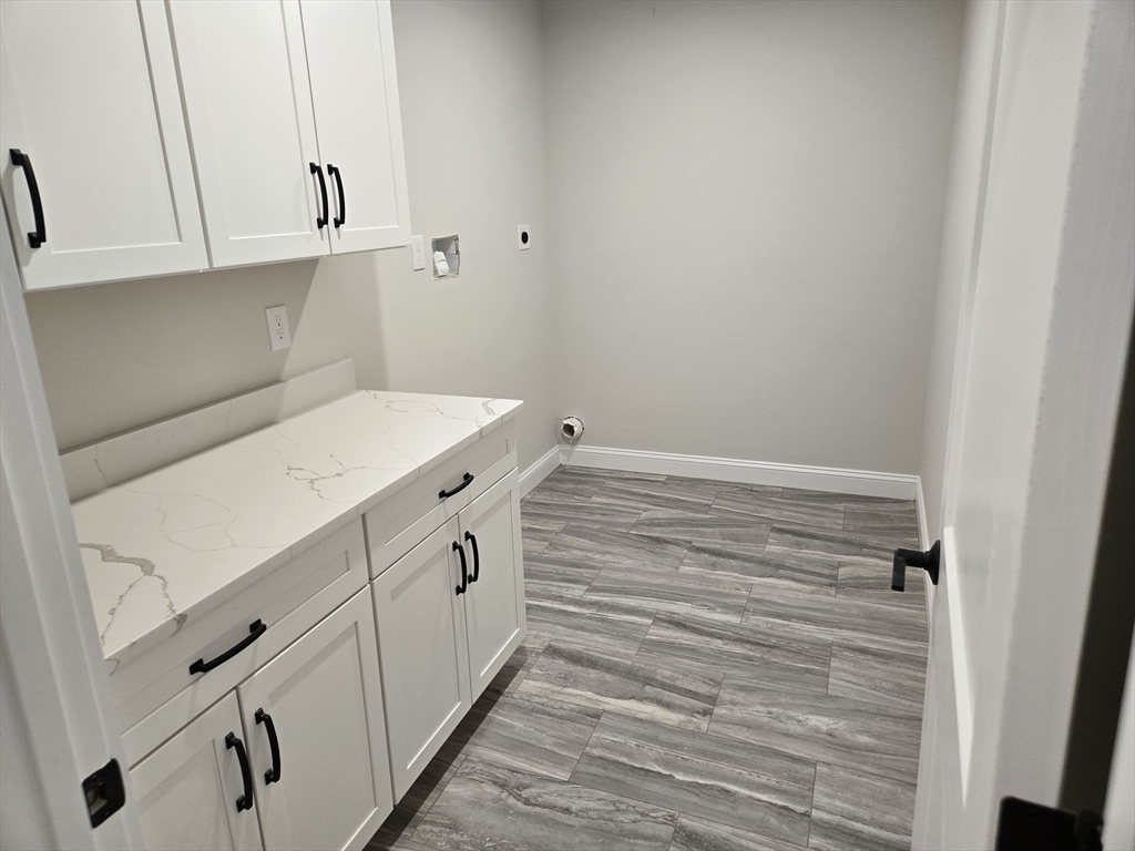 39 Tamarock Terrace Stoneham, MA 02180 - Photo 8 of 13 a view of cabinets and wooden floor