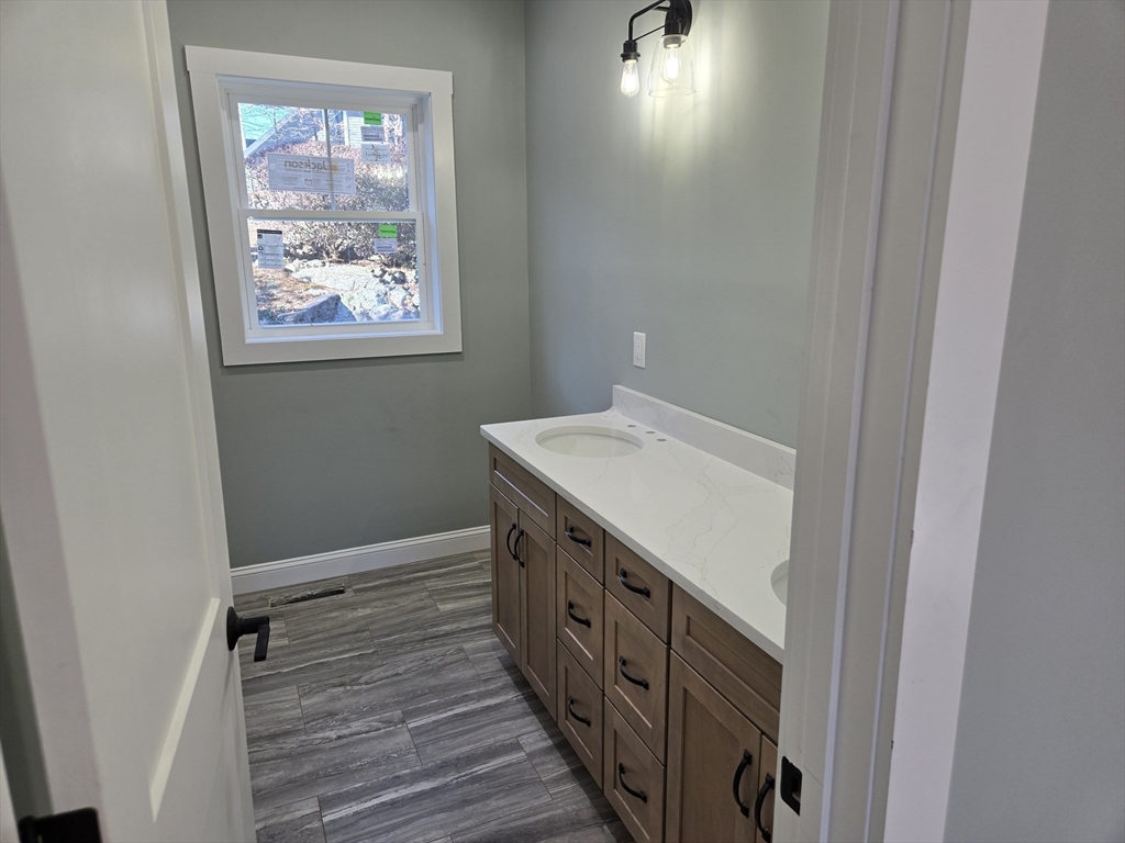 39 Tamarock Terrace Stoneham, MA 02180 - Photo 10 of 13 a bathroom with a sink and a window