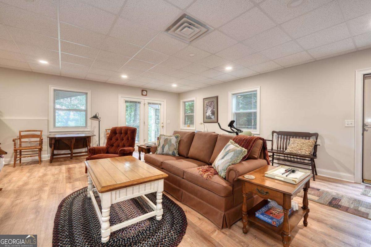 523 Sunnyside Shores Road Hiawassee, GA 30546 - Photo 31 of 55 a living room with furniture a couch and wooden floor