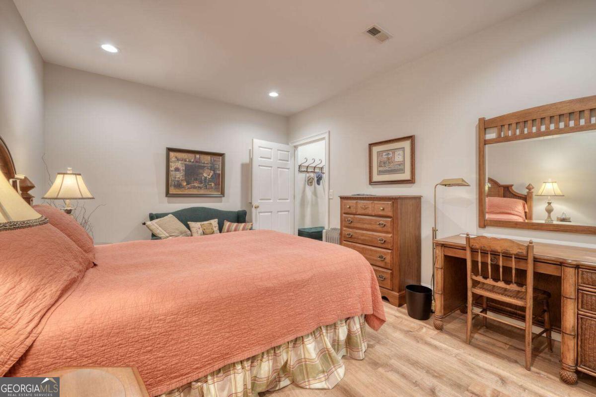 523 Sunnyside Shores Road Hiawassee, GA 30546 - Photo 34 of 55 a bedroom with a bed and wooden floor