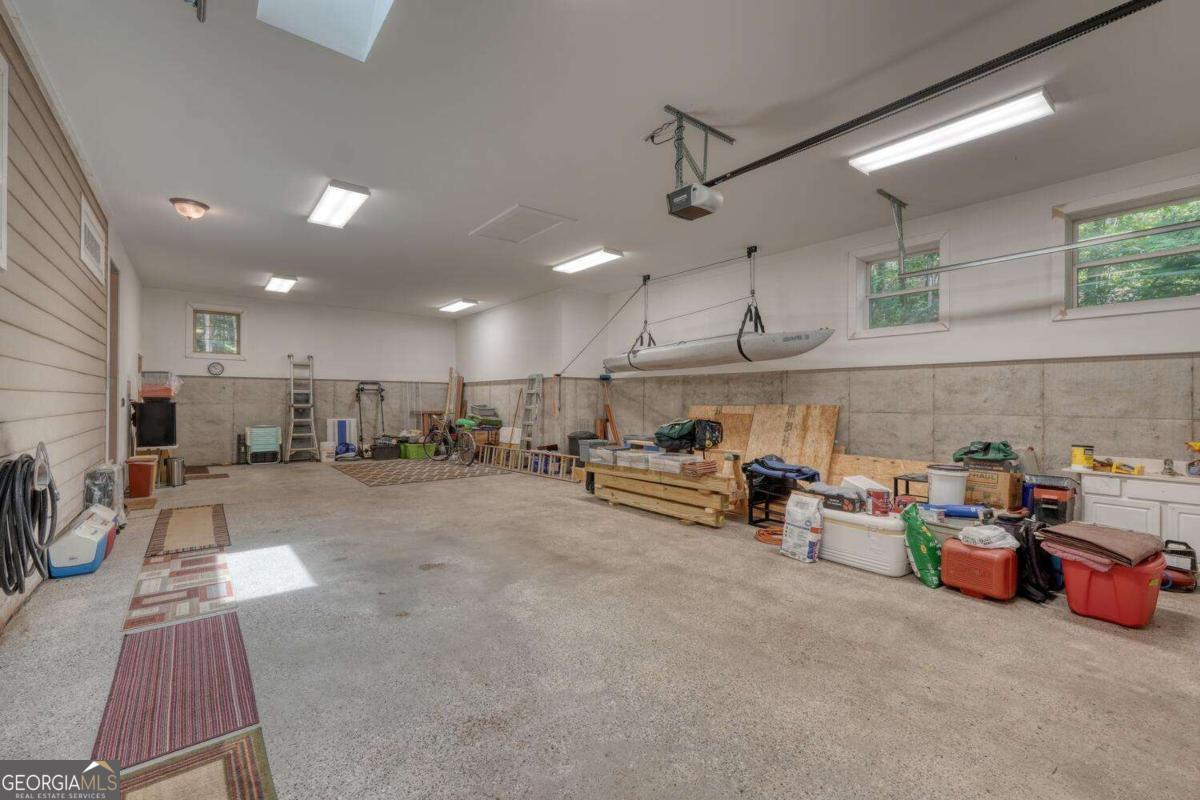523 Sunnyside Shores Road Hiawassee, GA 30546 - Photo 38 of 55 a view of a room with kitchen appliances and a table