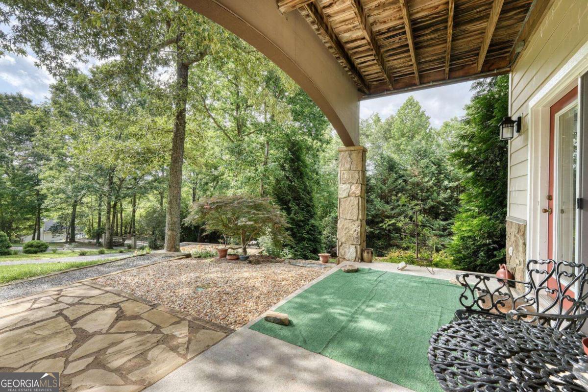 523 Sunnyside Shores Road Hiawassee, GA 30546 - Photo 43 of 55 a view of a couches under an umbrella