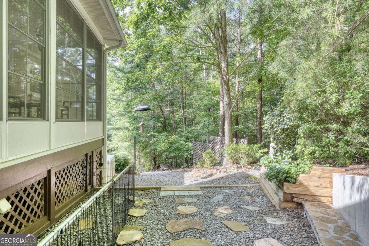 523 Sunnyside Shores Road Hiawassee, GA 30546 - Photo 49 of 55 a view of a porch with chairs and backyard