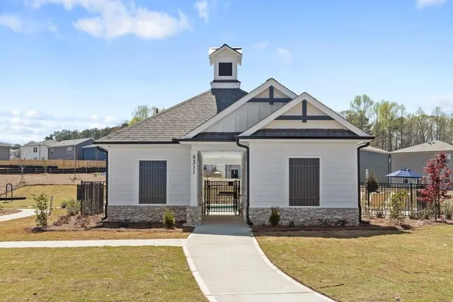 a front view of a house with garden