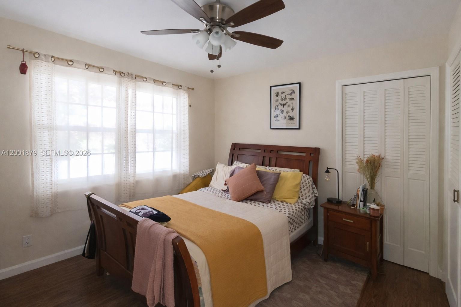 5524 Constant Spring Terrace, Unit 213 Lauderhill, FL 33319 - Photo 12 of 16 a bedroom with a bed and a window