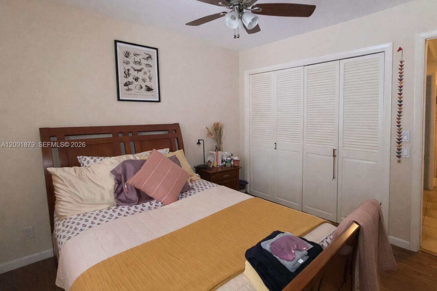 5524 Constant Spring Terrace, Unit 213 Lauderhill, FL 33319 - Photo 13 of 16 a bedroom with a bed and a desk