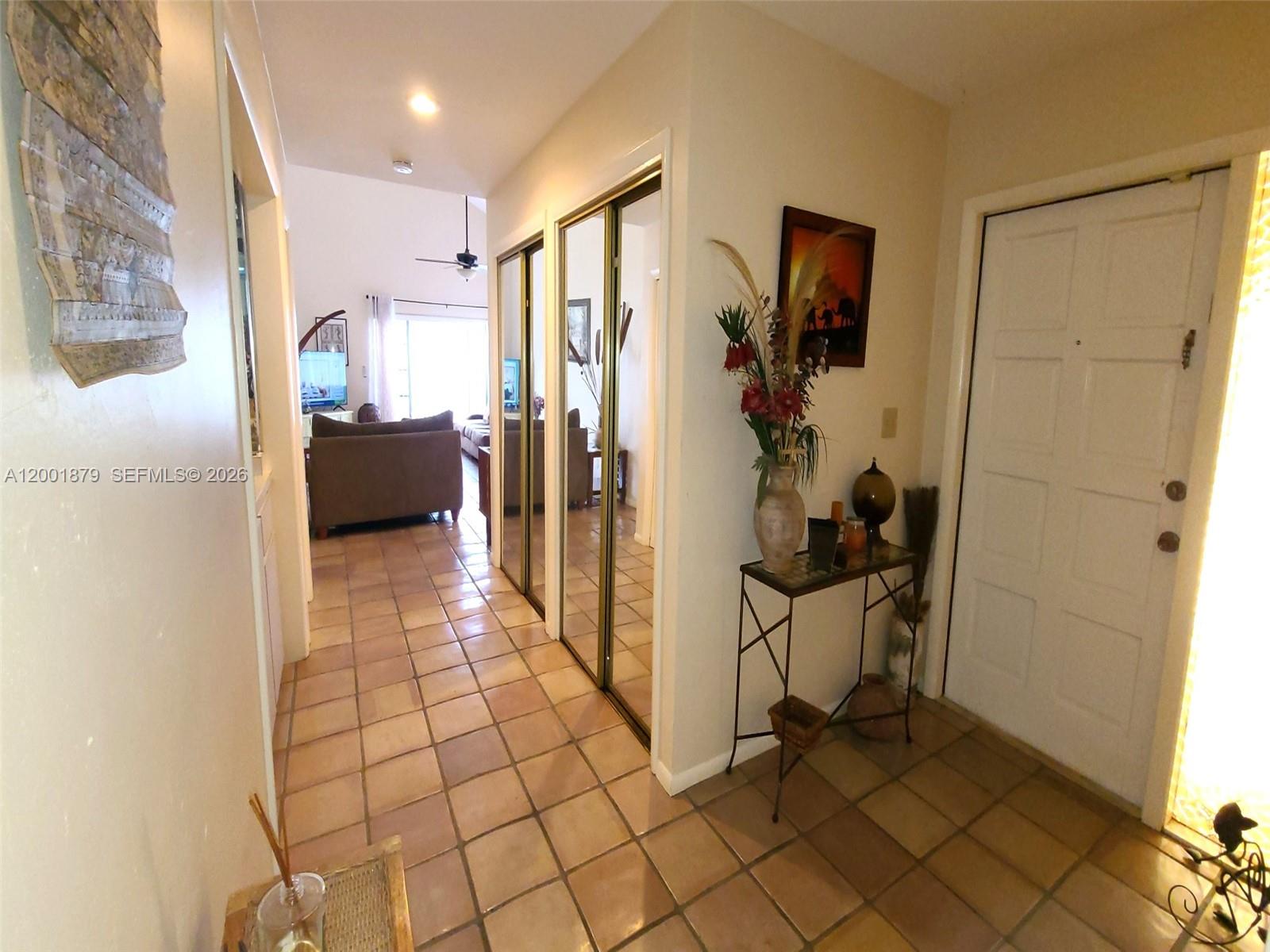 5524 Constant Spring Terrace, Unit 213 Lauderhill, FL 33319 - Photo 3 of 16 a view of a hallway and a livingroom with furniture