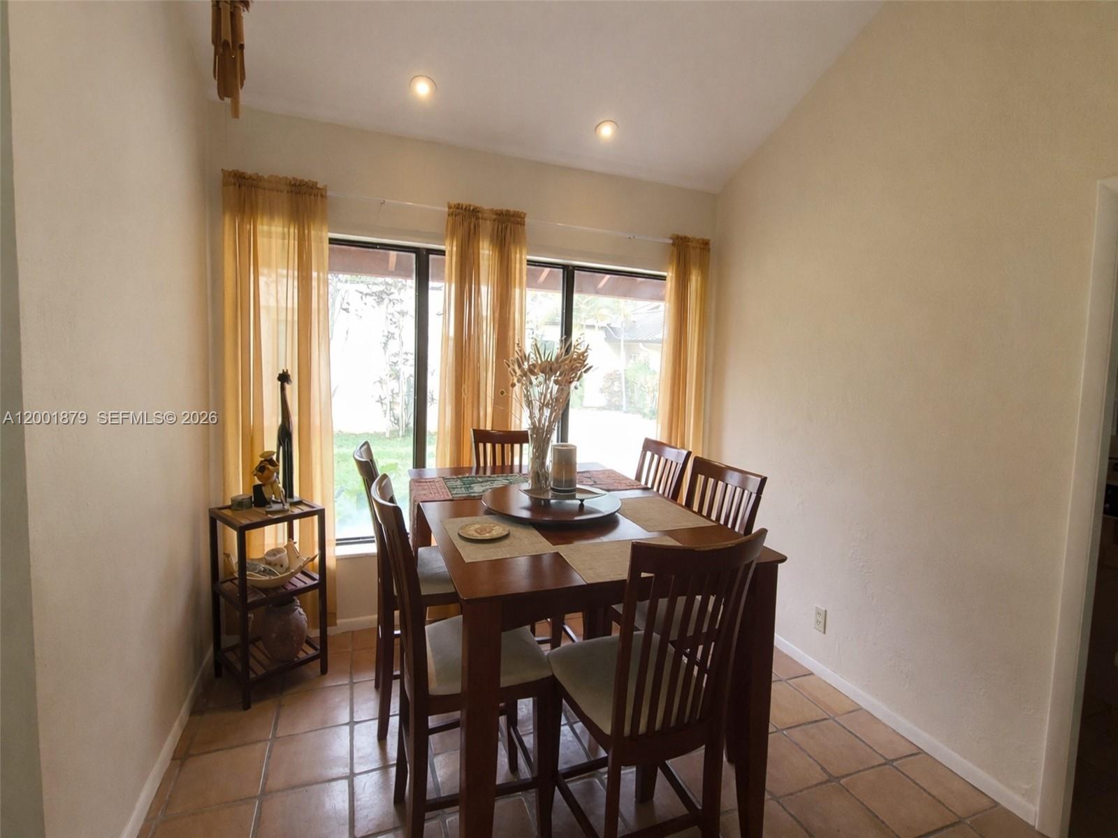 5524 Constant Spring Terrace, Unit 213 Lauderhill, FL 33319 - Photo 6 of 16 a view of a dining room with furniture and window