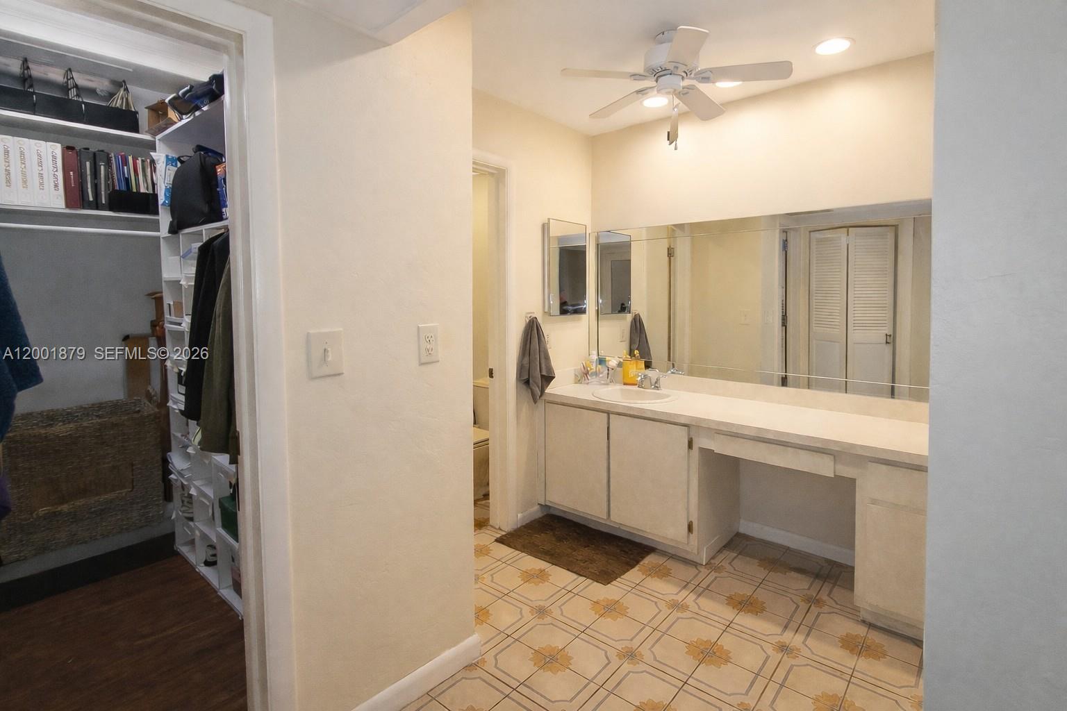 5524 Constant Spring Terrace, Unit 213 Lauderhill, FL 33319 - Photo 10 of 16 a bathroom with a sink and a mirror