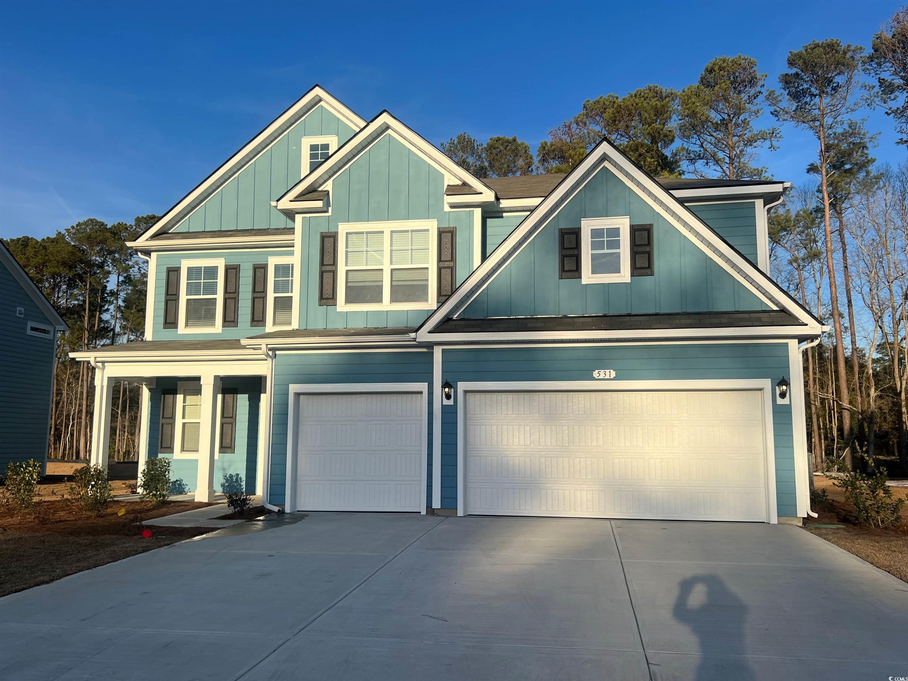 Craftsman inspired home with a garage