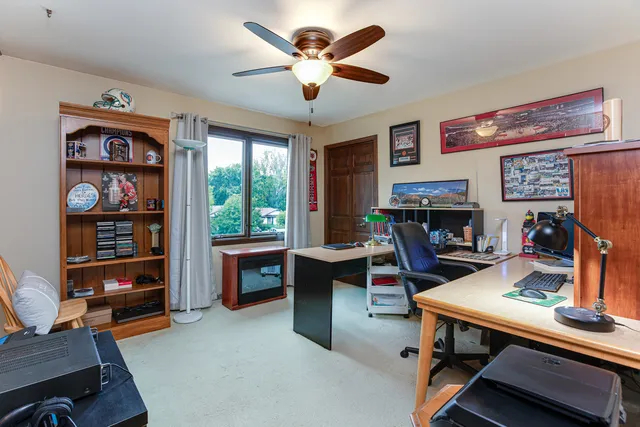 a work room with furniture and a window