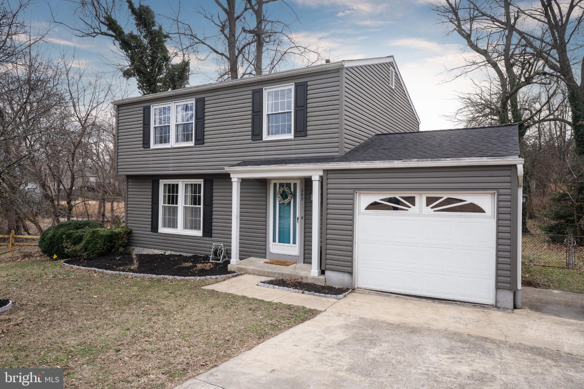 Charming two-story home with modern appeal.