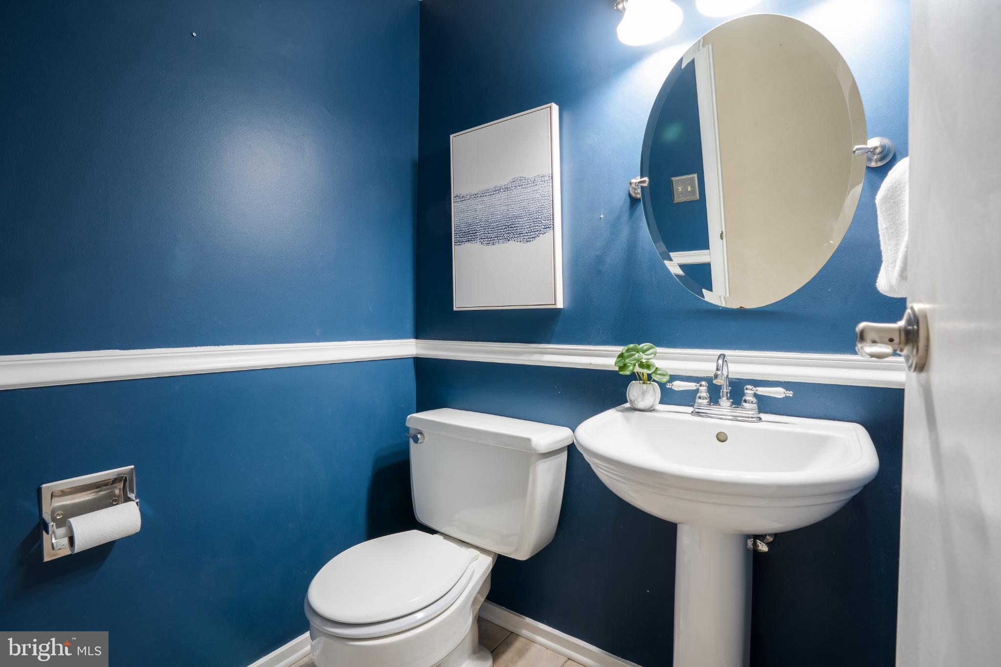 263 Riverdale Road Severna Park, MD 21146 - Photo 13 of 30 Chic half-bath with bold blue accents.