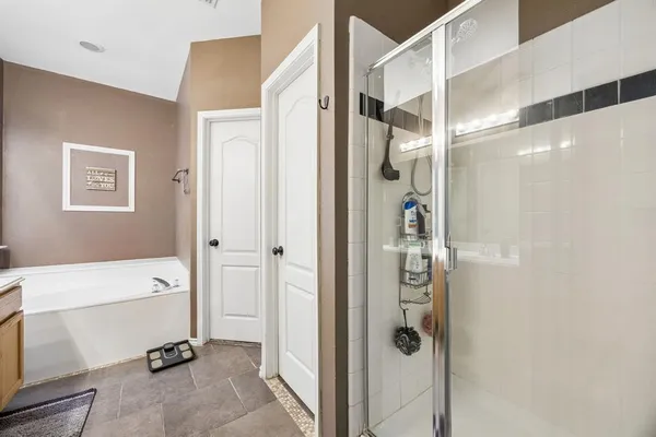 a bathroom with a glass shower door