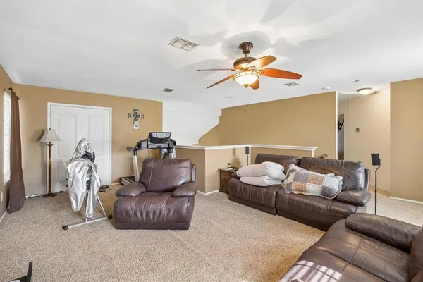 a bedroom with furniture and a chandelier