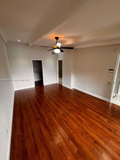 6724 Southwest 114th Place, Unit F Miami, FL 33173 - Photo 14 of 27 a view of an empty room with wooden floor and a ceiling fan