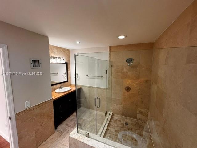 6724 Southwest 114th Place, Unit F Miami, FL 33173 - Photo 19 of 27 a bathroom with a granite countertop sink a toilet and shower