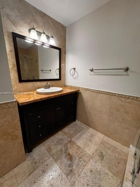 6724 Southwest 114th Place, Unit F Miami, FL 33173 - Photo 22 of 27 a bathroom with a sink and a mirror