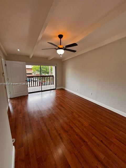 6724 Southwest 114th Place, Unit F Miami, FL 33173 - Photo 23 of 27 wooden floor in an empty room with a window