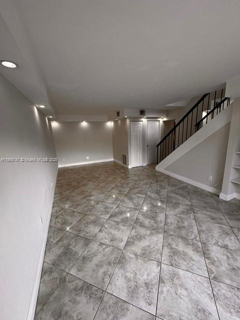6724 Southwest 114th Place, Unit F Miami, FL 33173 - Photo 25 of 27 a view of a hallway