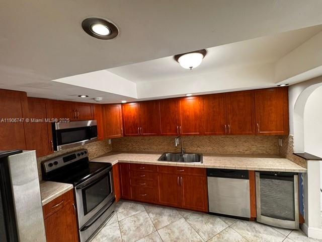 6724 Southwest 114th Place, Unit F Miami, FL 33173 - Photo 9 of 27 a kitchen with granite countertop a sink and a stove