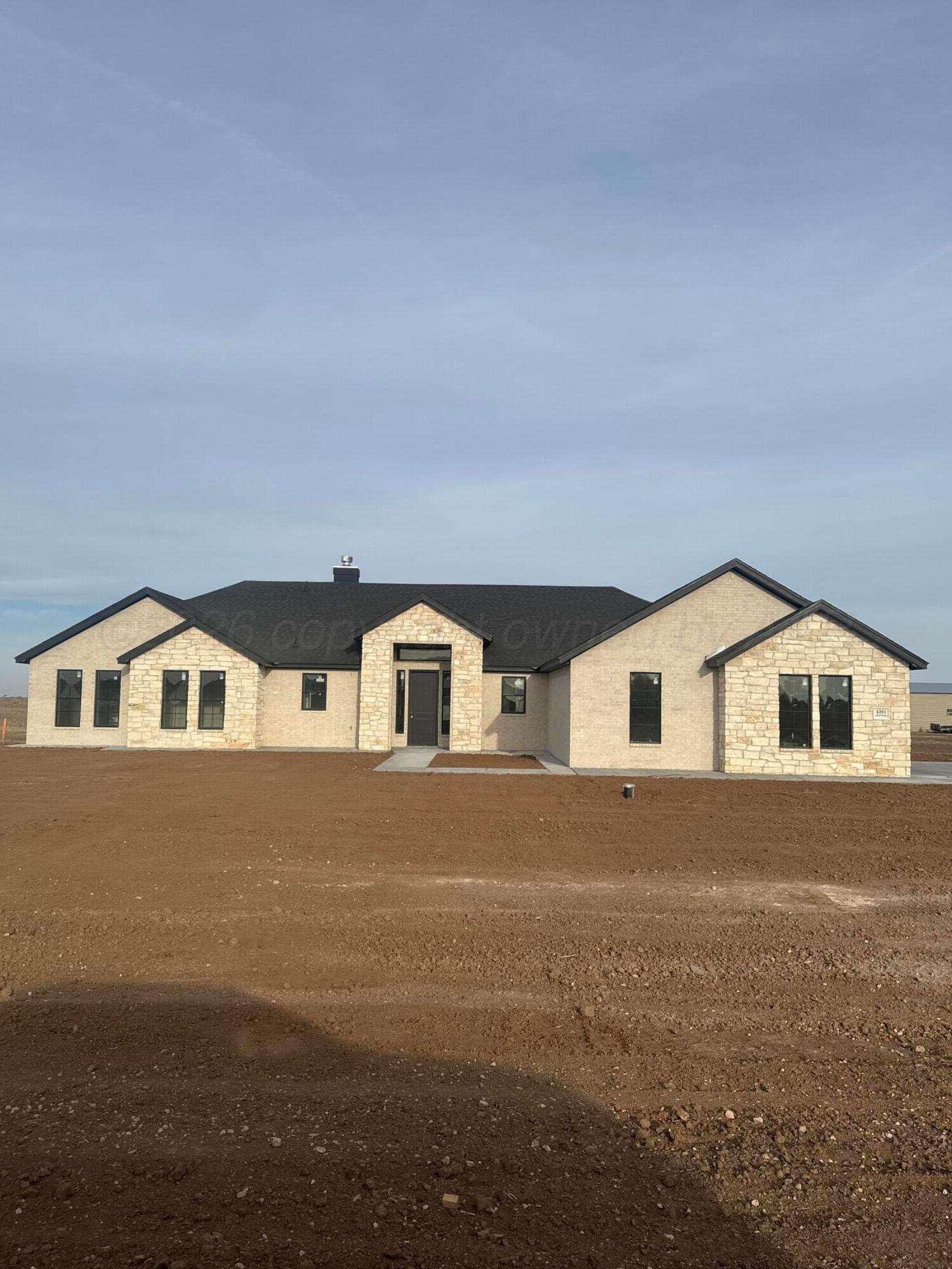4201 Juniper Springs Road Amarillo, TX 79119 - Photo 12 of 27 a front view of a house with yard