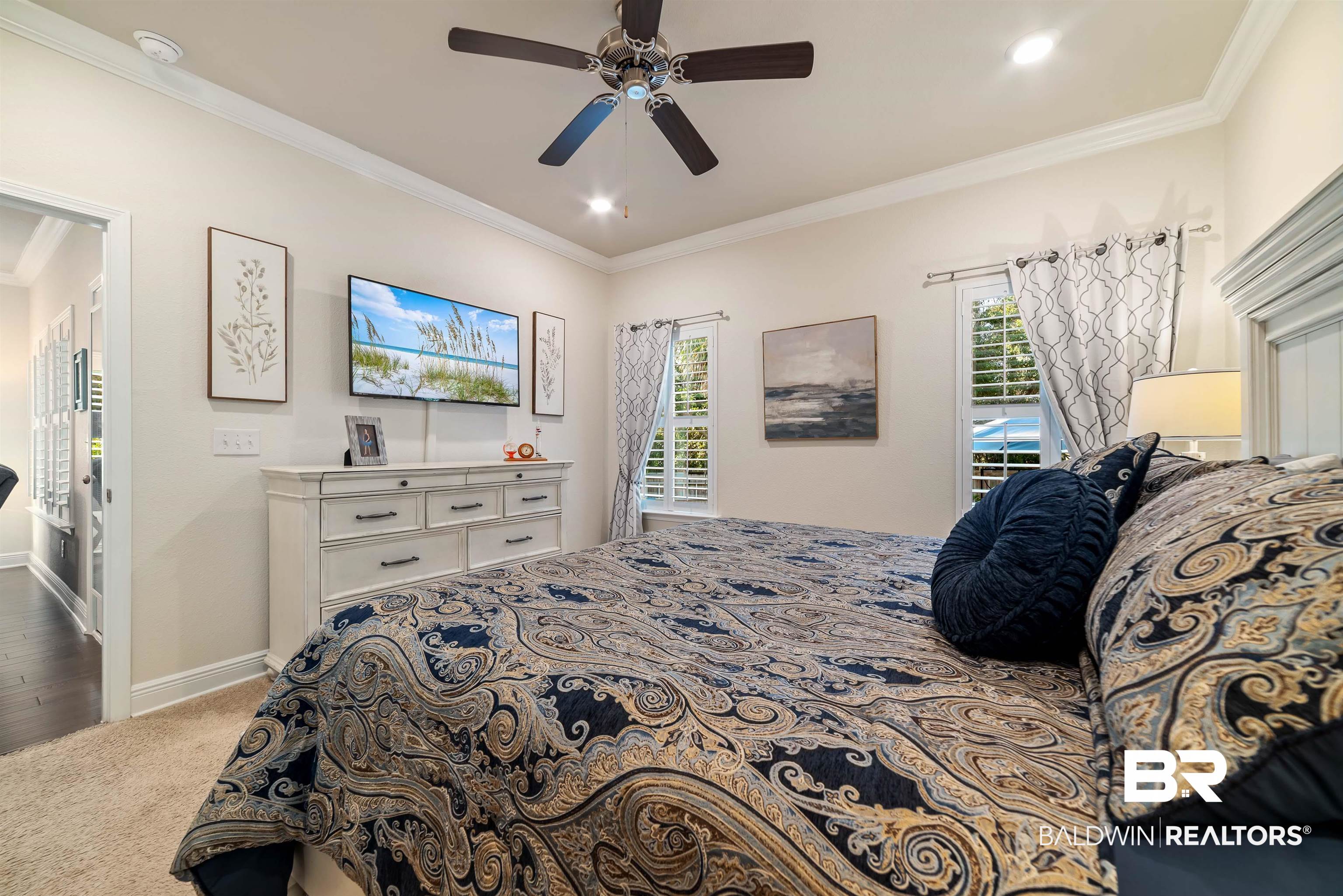 1290 Mako Loop Gulf Shores, AL 36542 - Photo 17 of 50 Carpeted bedroom featuring baseboards, ceiling fan, multiple windows, and crown molding