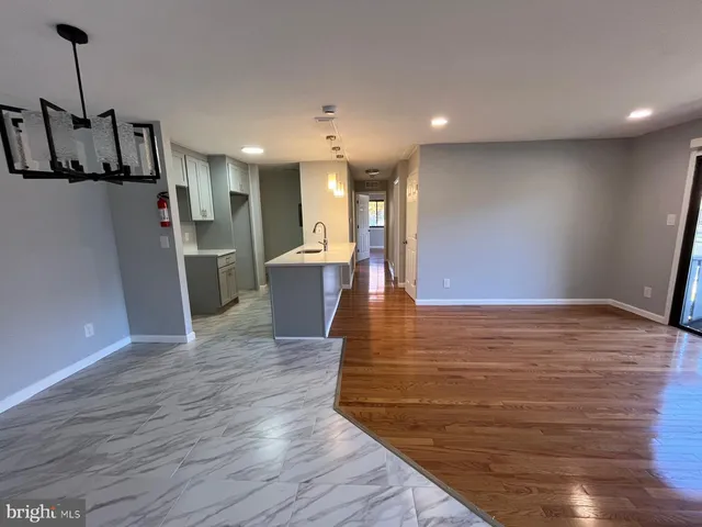 a view of kitchen with cabinets and wooden floor