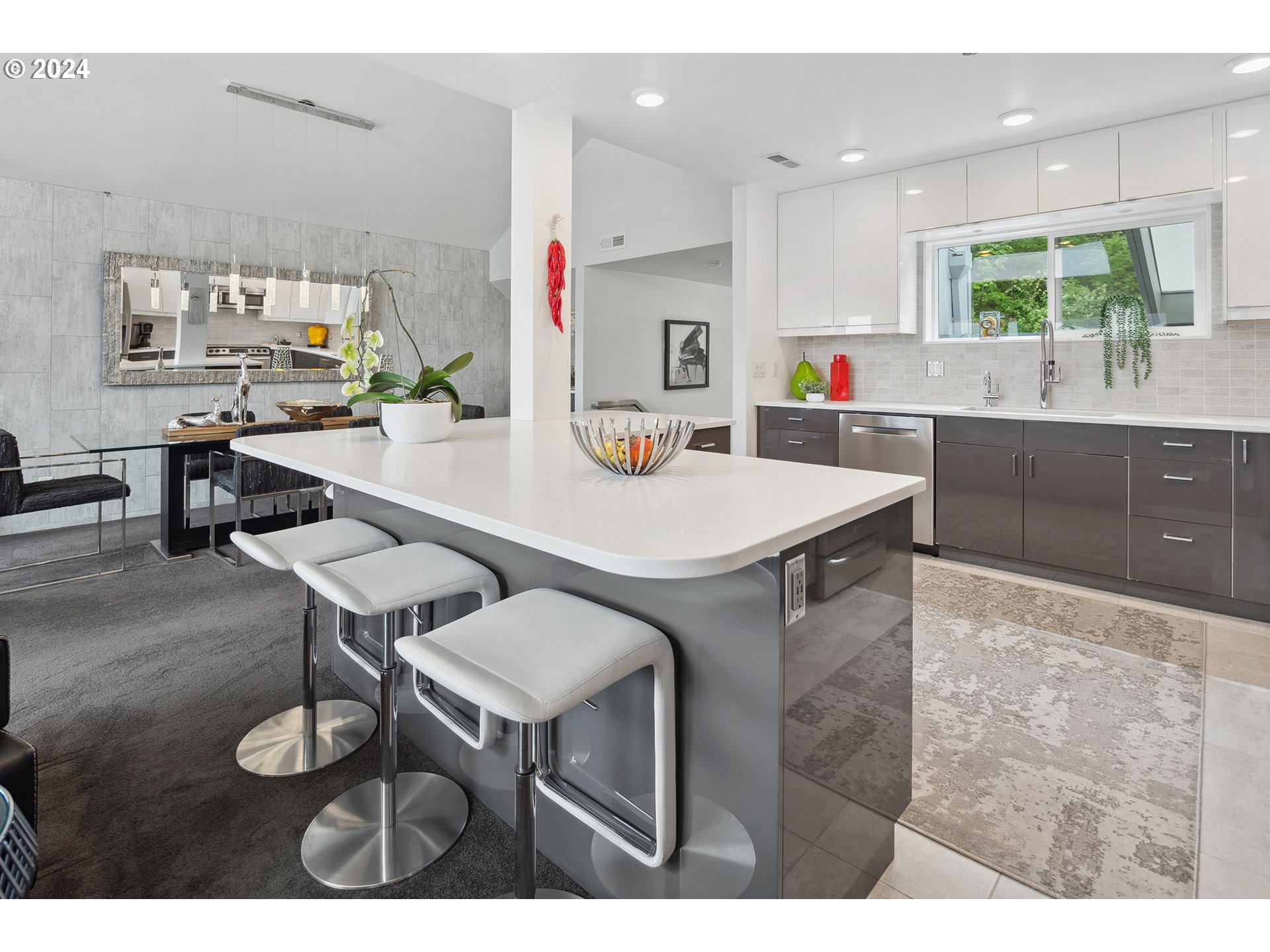 5427 Southwest View Point Terrace Portland, OR 97239 - Photo 14 of 40 a kitchen with a table chairs stove and cabinets