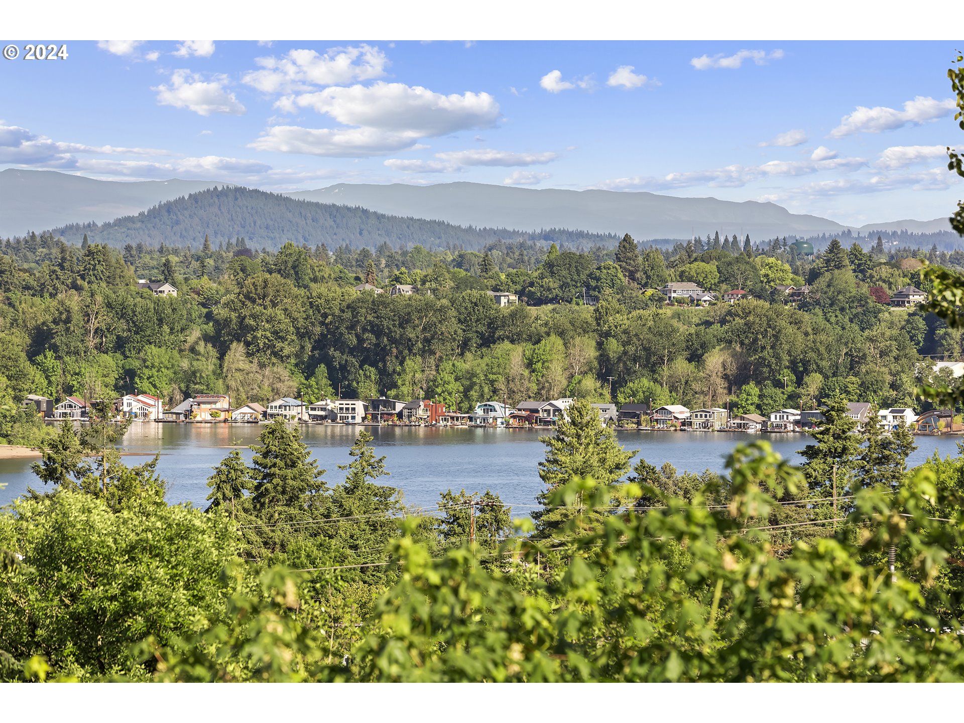 5427 Southwest View Point Terrace Portland, OR 97239 - Photo 16 of 40 a view of a lake with mountains in the background