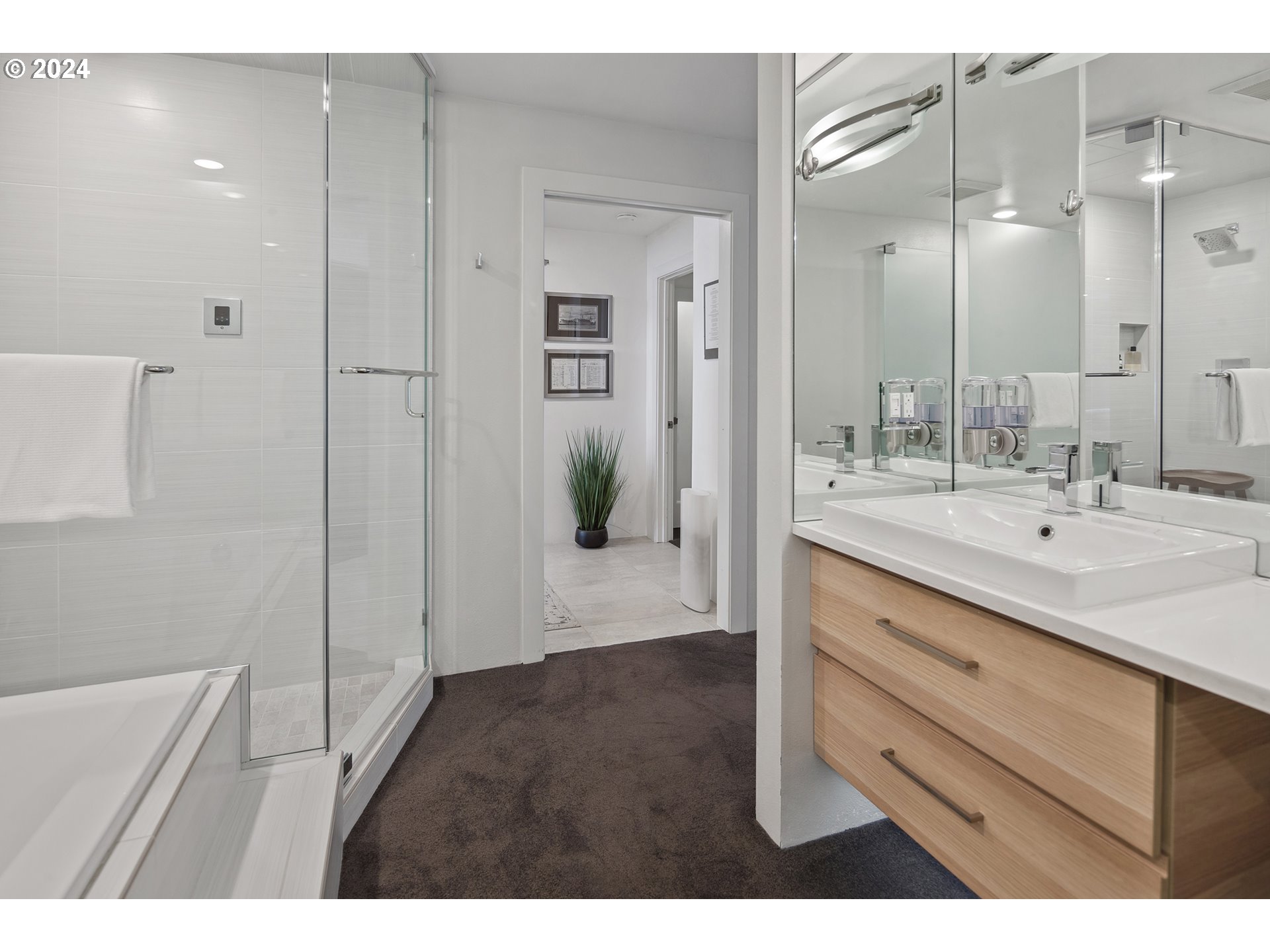 5427 Southwest View Point Terrace Portland, OR 97239 - Photo 22 of 40 a bathroom with a sink and a mirror