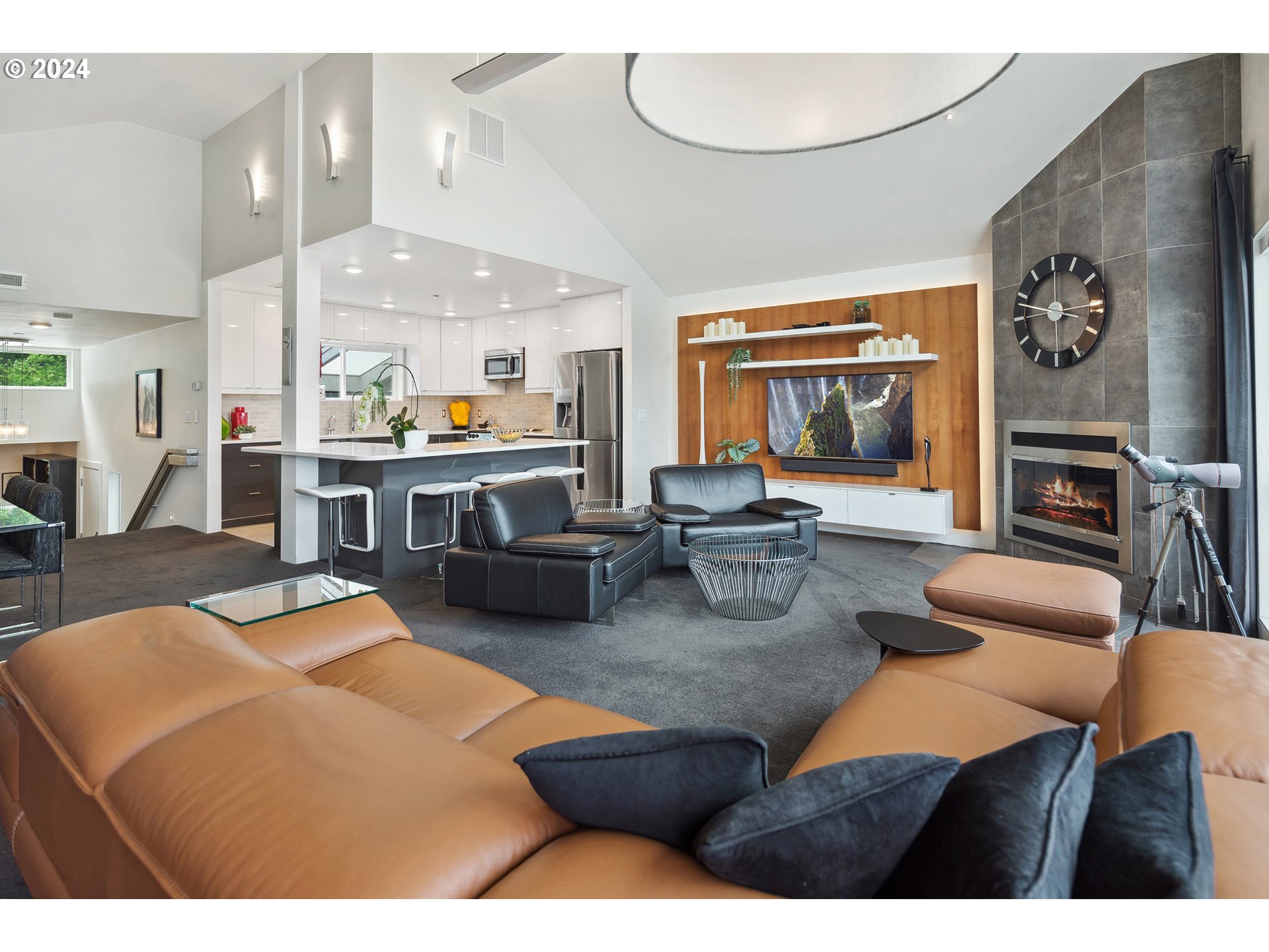 5427 Southwest View Point Terrace Portland, OR 97239 - Photo 26 of 40 a living room with furniture a rug and a painting