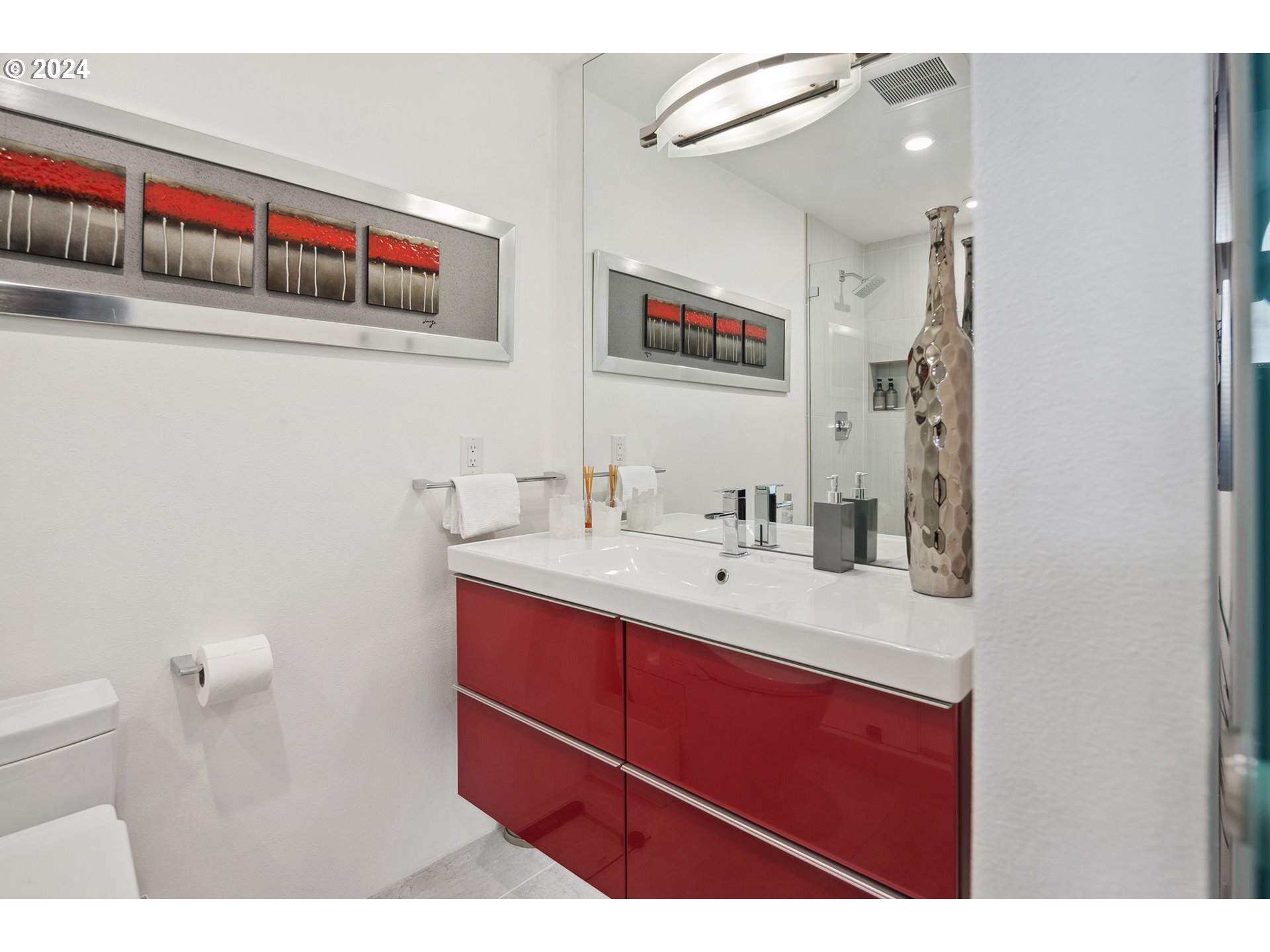 5427 Southwest View Point Terrace Portland, OR 97239 - Photo 30 of 40 a bathroom with a sink and a mirror