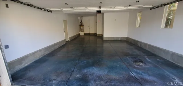 a view of house with backyard and garden