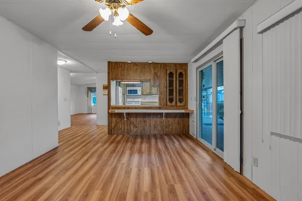 a view of kitchen with furniture and wooden floor