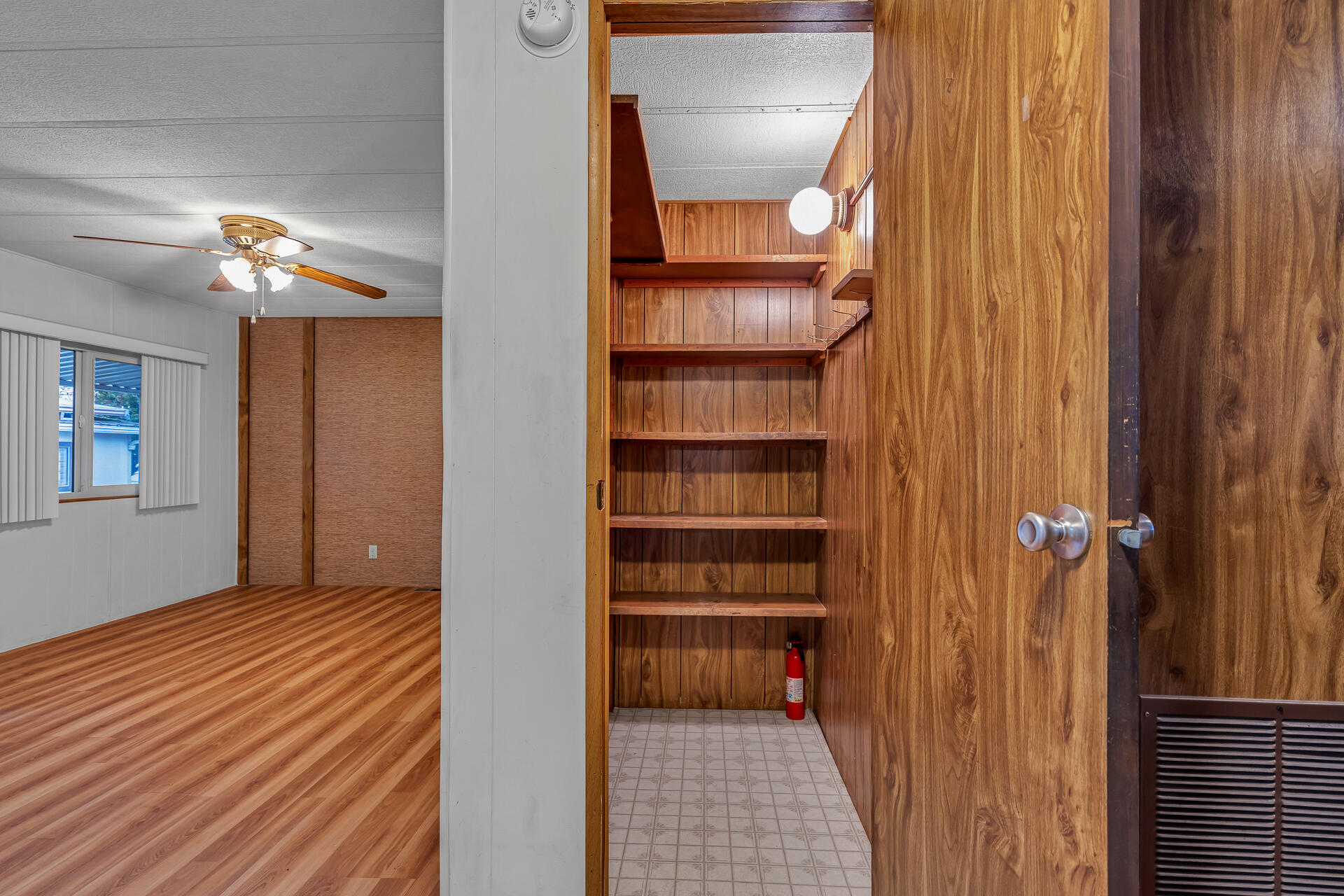 350 Gilmore Road, Unit SPC 88 Red Bluff, CA 96080 - Photo 9 of 31 a view of a hallway with wooden floor and closet