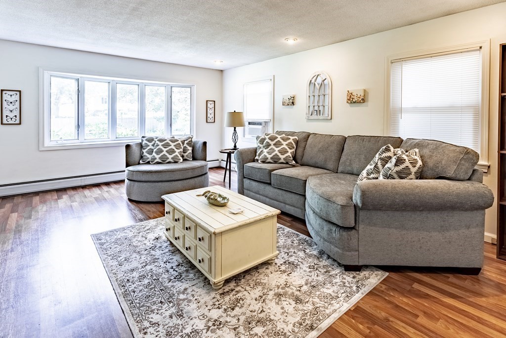52 Embassy Road Springfield, MA 01119 - Photo 15 of 27 a living room with furniture and a rug