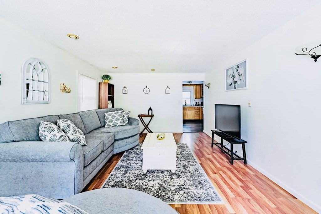 52 Embassy Road Springfield, MA 01119 - Photo 17 of 27 a living room with furniture and a flat screen tv