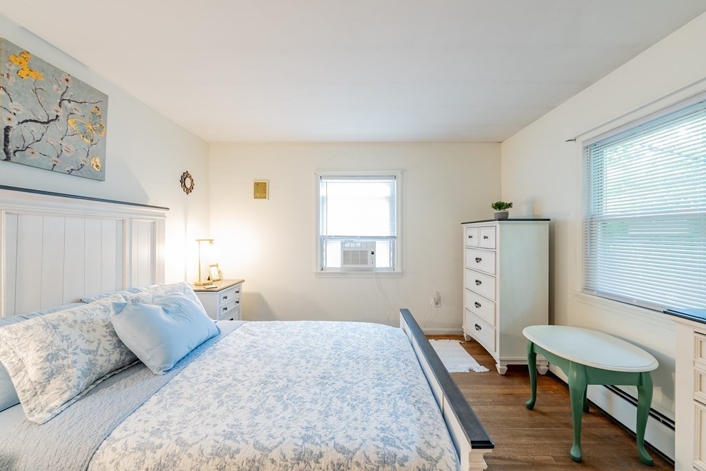 52 Embassy Road Springfield, MA 01119 - Photo 19 of 27 a bedroom with a bed and a table in it