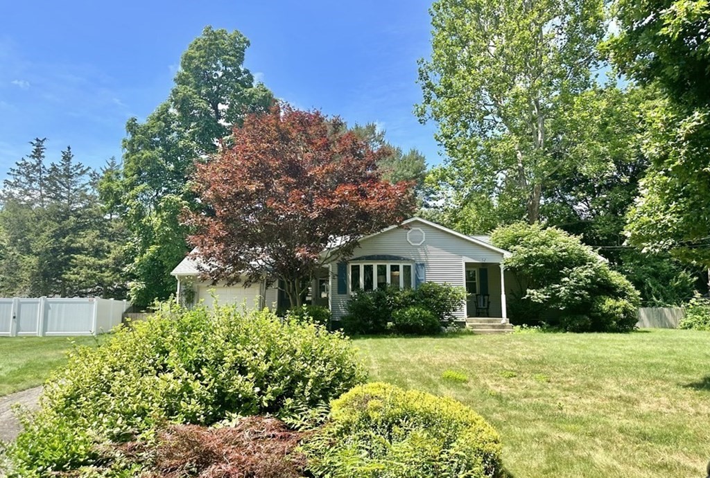 52 Embassy Road Springfield, MA 01119 - Photo 3 of 27 a front view of a house with a yard