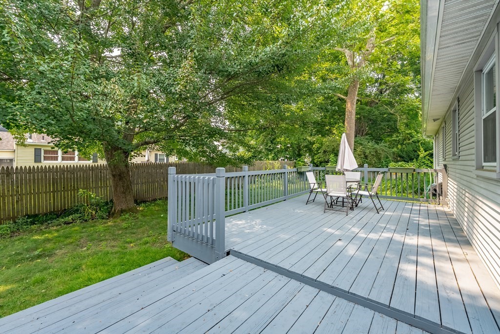 52 Embassy Road Springfield, MA 01119 - Photo 8 of 27 a view of a chairs and table on the wooden deck